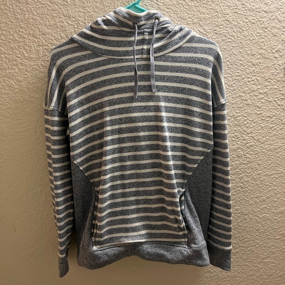 Grey and white stripped hoodie. Sits high on the neck, cozy fit